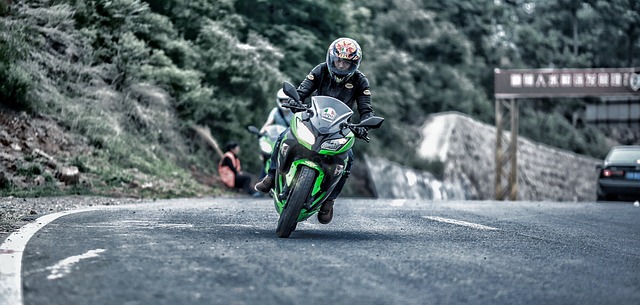 A rider riding motorcycle on the road. 